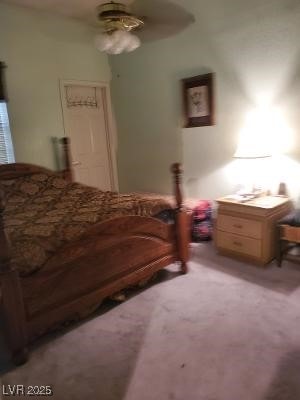 bedroom featuring a ceiling fan and light colored carpet