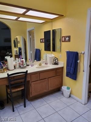 bathroom featuring tile patterned flooring and vanity