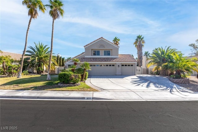view of front of home with fence, an attached garage, stucco siding, concrete driveway, and a tiled roof