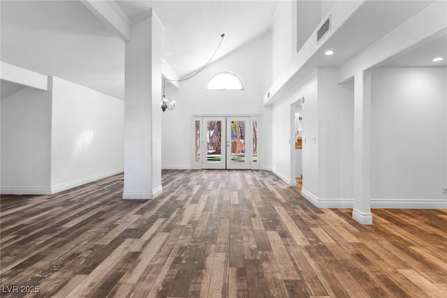 entryway featuring baseboards, french doors, hardwood / wood-style flooring, and visible vents