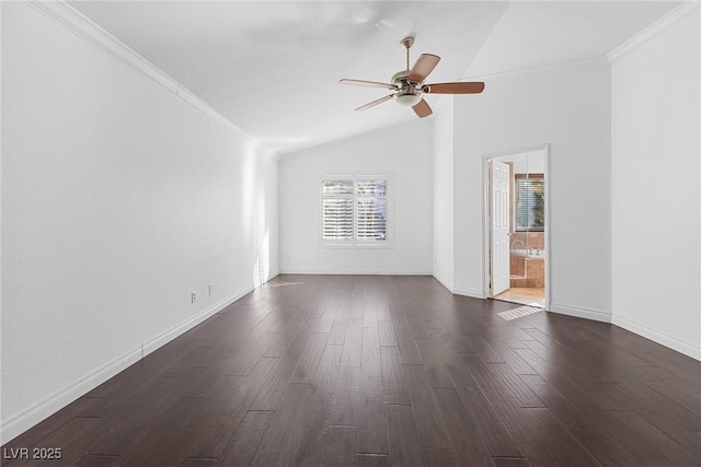 unfurnished room featuring crown molding, ceiling fan, dark wood finished floors, baseboards, and lofted ceiling