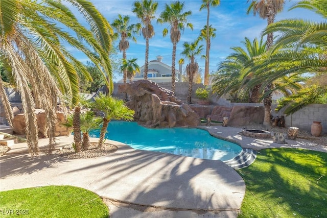 view of pool with a fenced backyard, a fenced in pool, a patio, and an outdoor fire pit