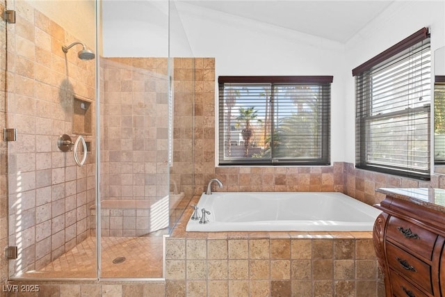bathroom featuring a shower stall, a wealth of natural light, and a garden tub