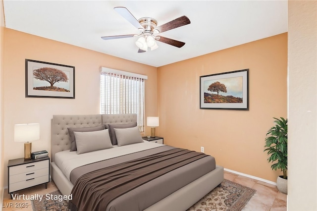 bedroom with baseboards, a ceiling fan, and light tile patterned floors