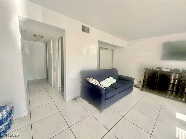 living room featuring marble finish floor and visible vents