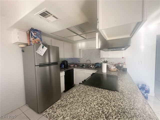kitchen with visible vents, dishwasher, a sink, white cabinets, and freestanding refrigerator