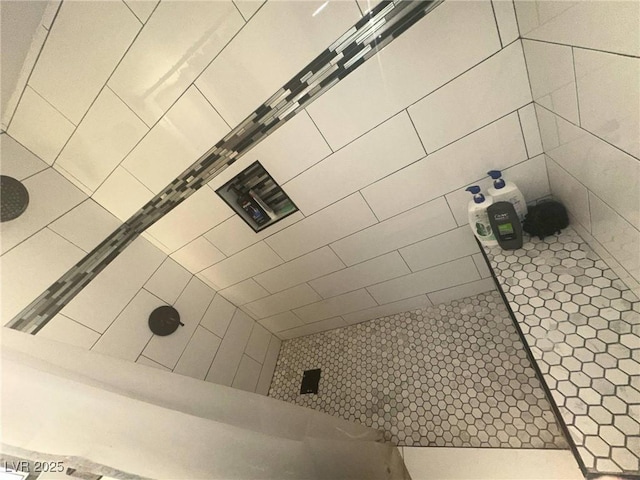 bathroom with a tile shower