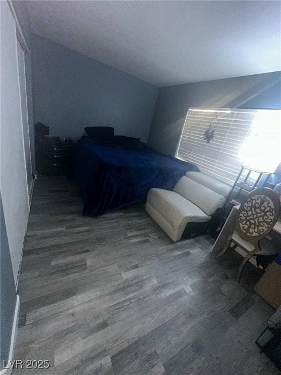 bedroom with wood finished floors