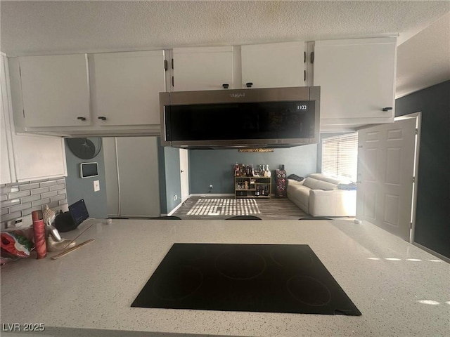 living room with a textured ceiling