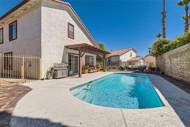 view of pool with area for grilling, a patio, a fenced in pool, a fenced backyard, and a pergola