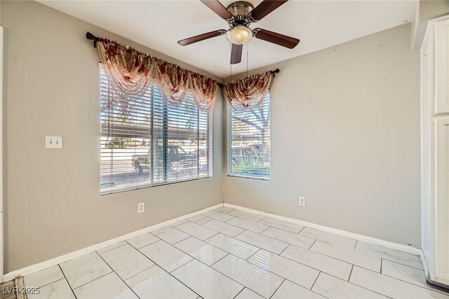 4955 Lindell Rd Unit 130, Las Vegas, NV 89118 - empty room with a ceiling fan and baseboards