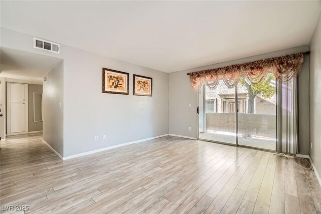 4955 Lindell Rd Unit 130, Las Vegas, NV 89118 - unfurnished room with light wood finished floors and baseboards