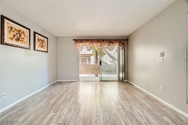 4955 Lindell Rd Unit 130, Las Vegas, NV 89118 - spare room featuring light wood finished floors and baseboards