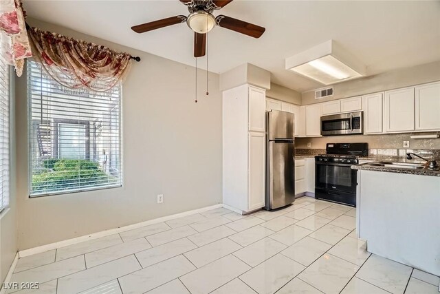4955 Lindell Rd Unit 130, Las Vegas, NV 89118 - kitchen with appliances with stainless steel finishes, a sink, plenty of natural light, and white cabinetry