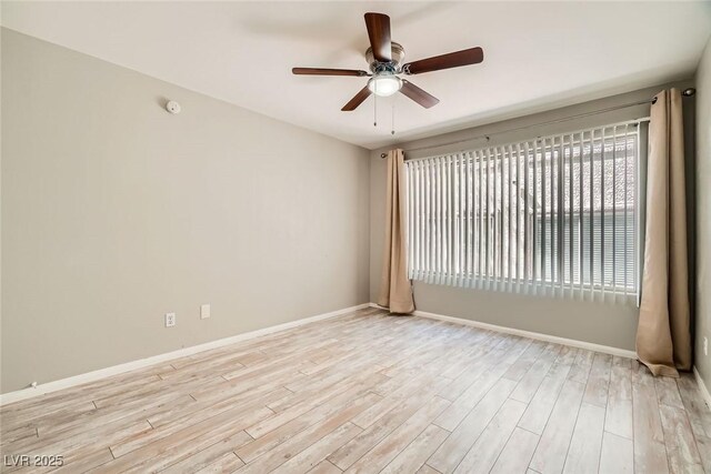 4955 Lindell Rd Unit 130, Las Vegas, NV 89118 - unfurnished room with ceiling fan, light wood-style floors, and baseboards