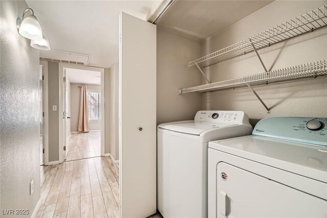 4955 Lindell Rd Unit 130, Las Vegas, NV 89118 - laundry area featuring separate washer and dryer and light wood finished floors