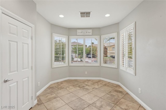 unfurnished room with baseboards, recessed lighting, light tile patterned flooring, and visible vents