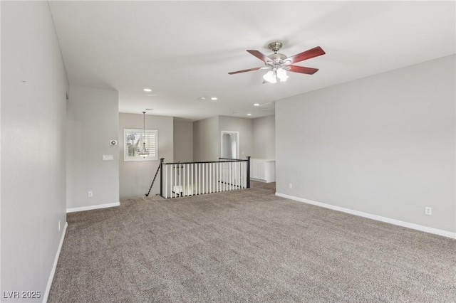 empty room featuring recessed lighting, baseboards, ceiling fan, and carpet