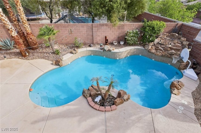 view of swimming pool with a patio, a fenced backyard, and a fenced in pool