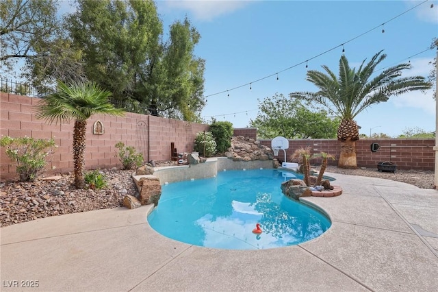 view of pool with a fenced in pool, a fenced backyard, and a patio area