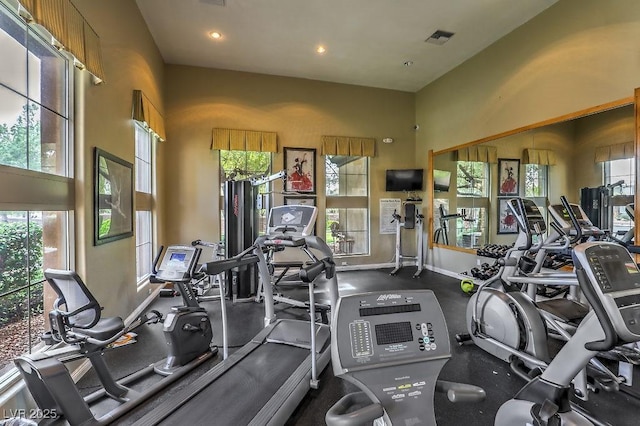 exercise room with baseboards, recessed lighting, and visible vents