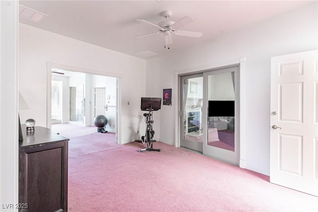 workout area with carpet floors and a ceiling fan