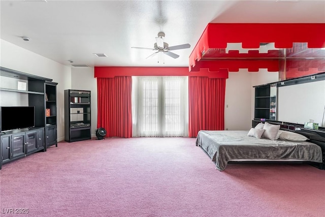 bedroom with carpet floors, ceiling fan, and visible vents
