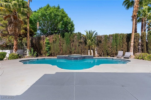 view of pool with a pool with connected hot tub and a patio area