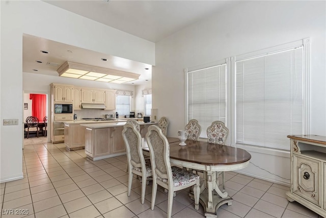 dining area with light tile patterned floors