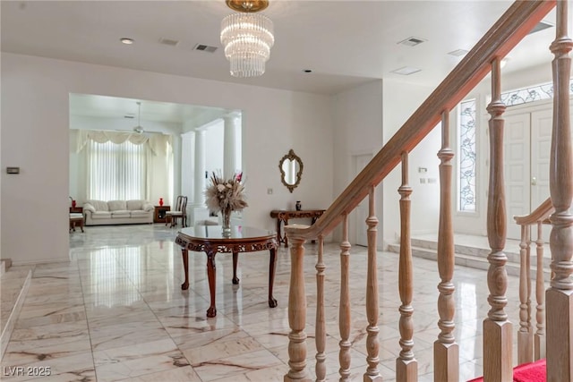 entryway featuring stairway, recessed lighting, marble finish floor, and visible vents