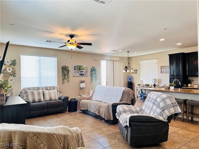5634 Bishop Flowers St, Las Vegas, NV 89130 - living room featuring light tile patterned flooring, healthy amount of natural light, ceiling fan, and recessed lighting