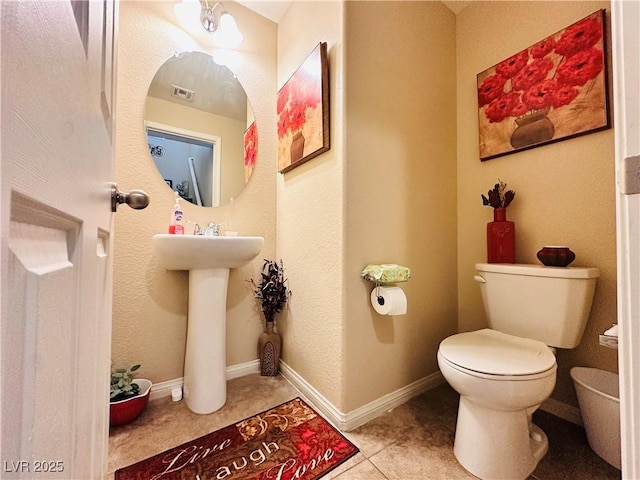 5634 Bishop Flowers St, Las Vegas, NV 89130 - half bath featuring toilet, tile patterned flooring, and a sink