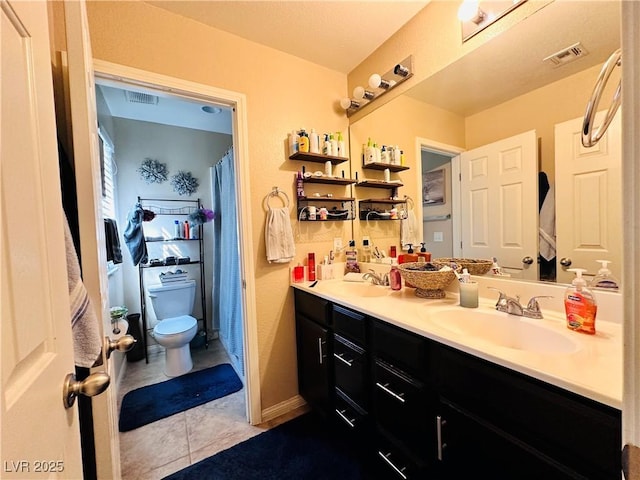 5634 Bishop Flowers St, Las Vegas, NV 89130 - full bath with toilet, double vanity, and tile patterned flooring