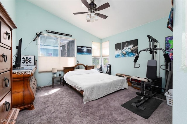 carpeted bedroom with a ceiling fan and vaulted ceiling