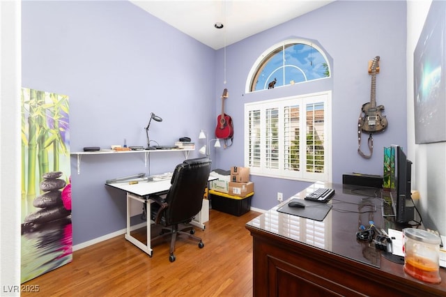 office area featuring baseboards and wood finished floors