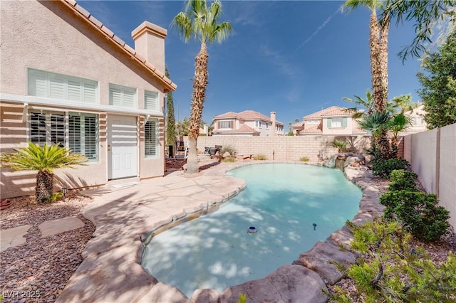 view of swimming pool with a fenced in pool, a fenced backyard, and a patio area