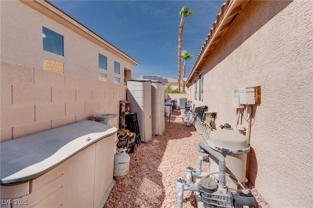 view of home's exterior featuring fence and stucco siding
