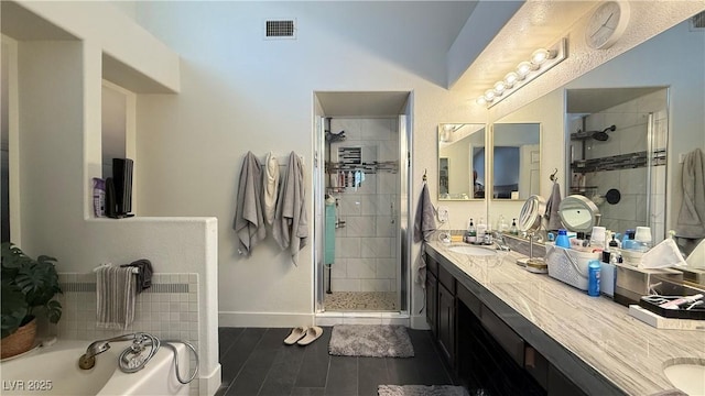 2701 Brookstone Ct, Las Vegas, NV 89117 - bathroom with a sink, baseboards, a stall shower, and visible vents