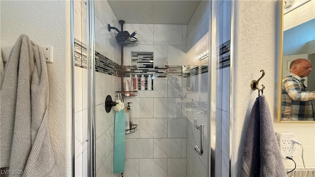 2701 Brookstone Ct, Las Vegas, NV 89117 - bathroom with a textured wall and a stall shower