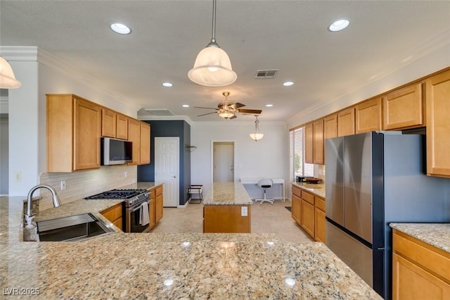 10372 Premia Pl, Las Vegas, NV 89135 - kitchen with a sink, stainless steel appliances, crown molding, light stone countertops, and ceiling fan