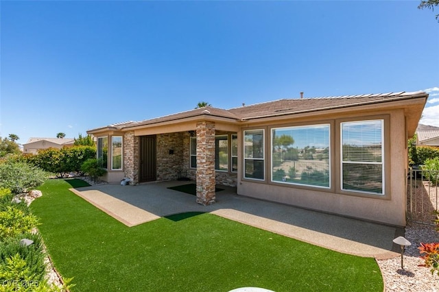 10372 Premia Pl, Las Vegas, NV 89135 - rear view of property featuring a patio and a yard