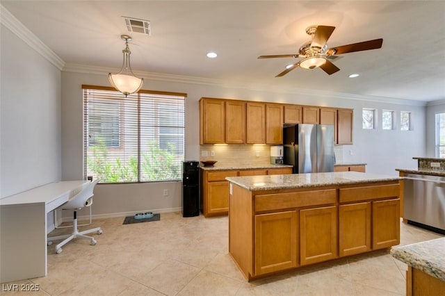 10372 Premia Pl, Las Vegas, NV 89135 - kitchen with stainless steel appliances, healthy amount of natural light, a center island, ornamental molding, and light tile patterned floors