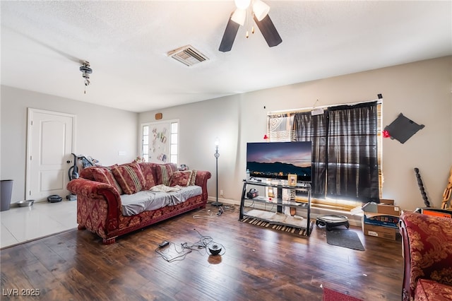 343 Tungsten St, Henderson, NV 89015 - living area featuring ceiling fan, a textured ceiling, baseboards, wood finished floors, and visible vents