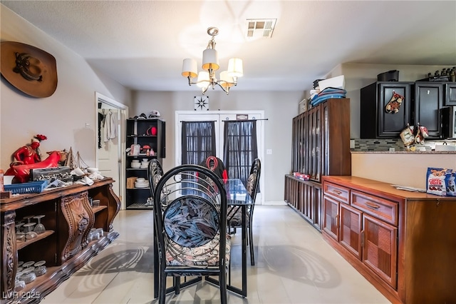 343 Tungsten St, Henderson, NV 89015 - dining space with visible vents and an inviting chandelier