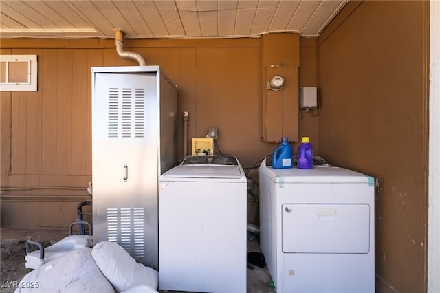 343 Tungsten St, Henderson, NV 89015 - clothes washing area featuring laundry area, wood walls, and washer and dryer