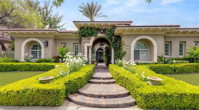 mediterranean / spanish-style house featuring stucco siding