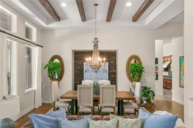 dining area featuring beam ceiling, wood finished floors, baseboards, recessed lighting, and a chandelier