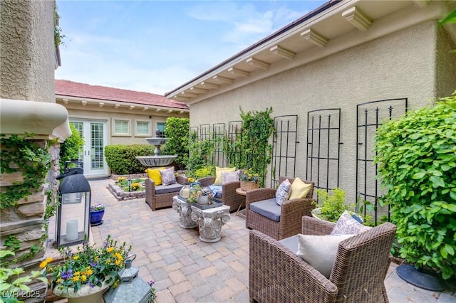 view of patio / terrace with fence and an outdoor hangout area