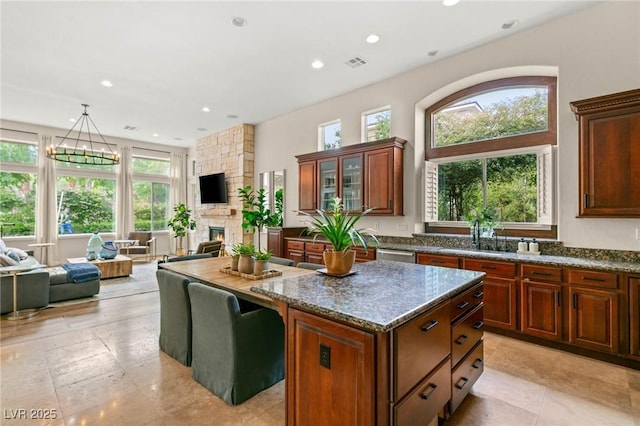 kitchen featuring a center island, plenty of natural light, and open floor plan