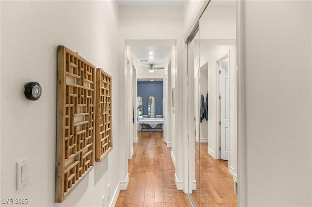 hall with light wood-style flooring